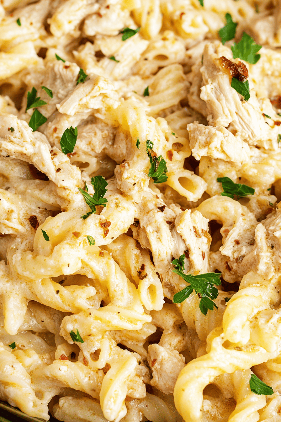 Crockpot Garlic Parmesan Chicken Pasta slice on plate showing perfect texture and swirl pattern