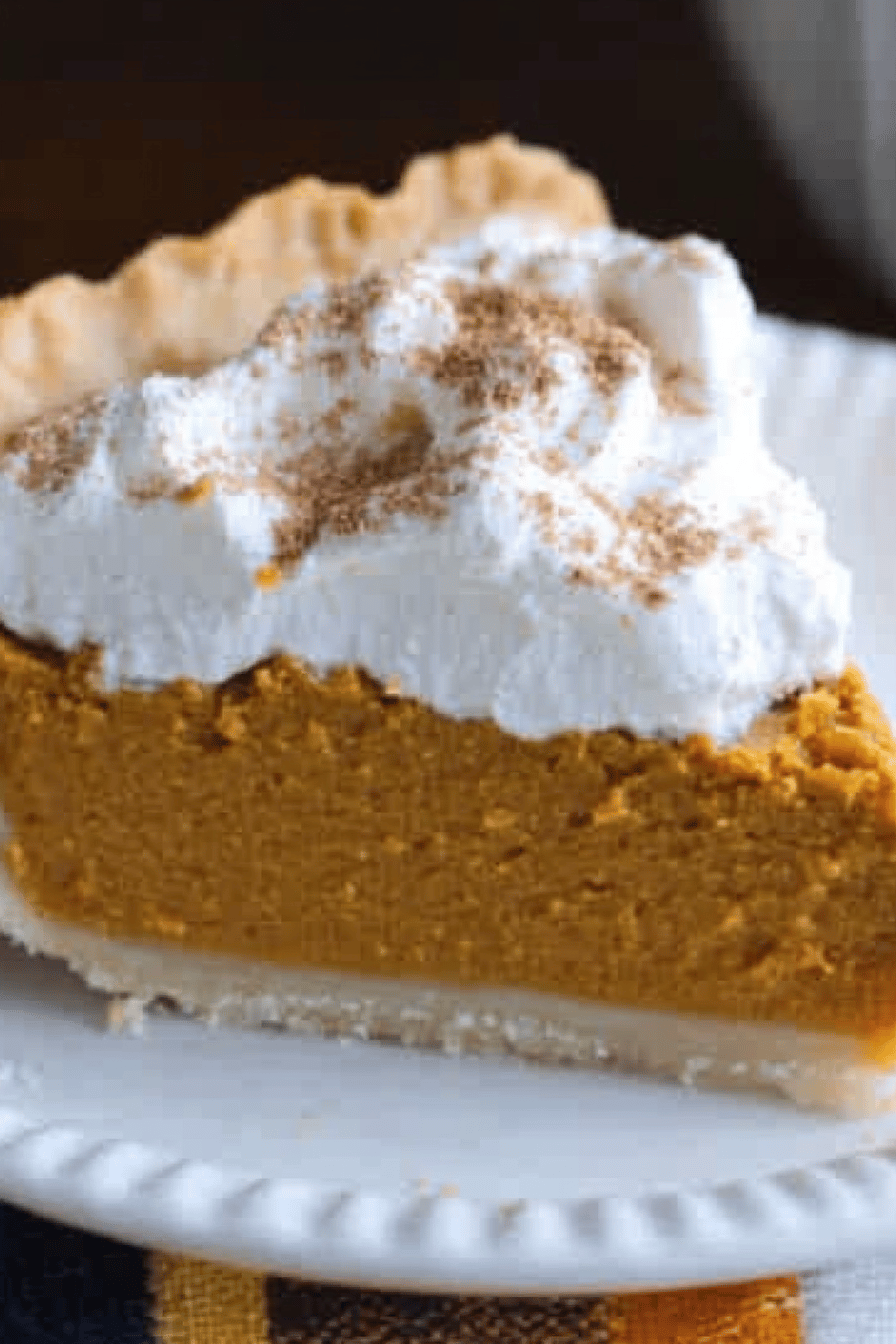 pumpkin pie recipe ingredients organized and measured on kitchen counter