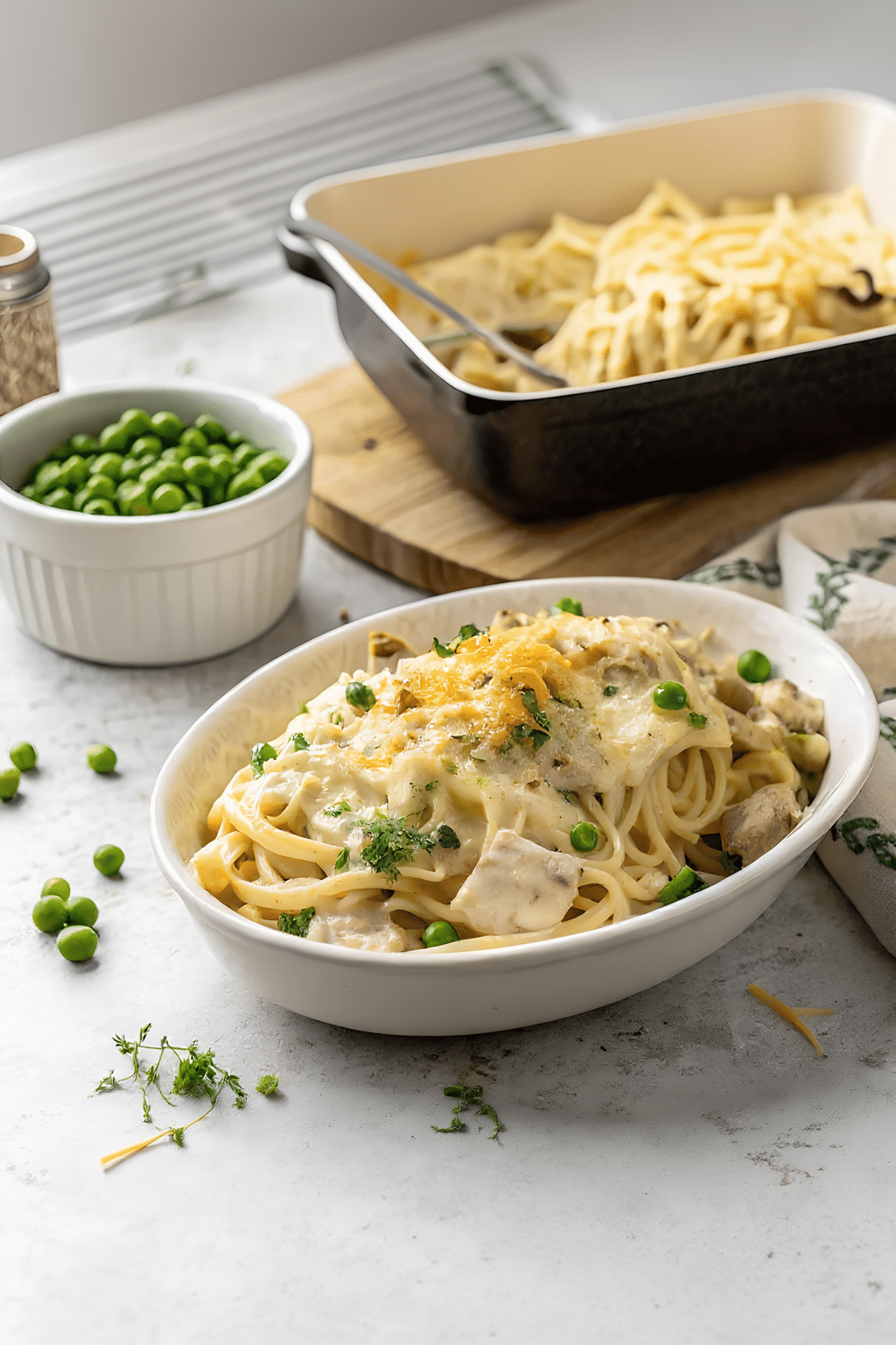 Serving of creamy turkey tetrazzini with peas and mozzarella