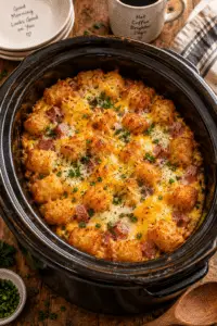 Crock pot tater tot egg bake with golden tater tots and cheese
